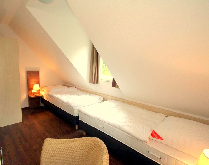 Schlafzimmer mit getrennten Betten Haus 6